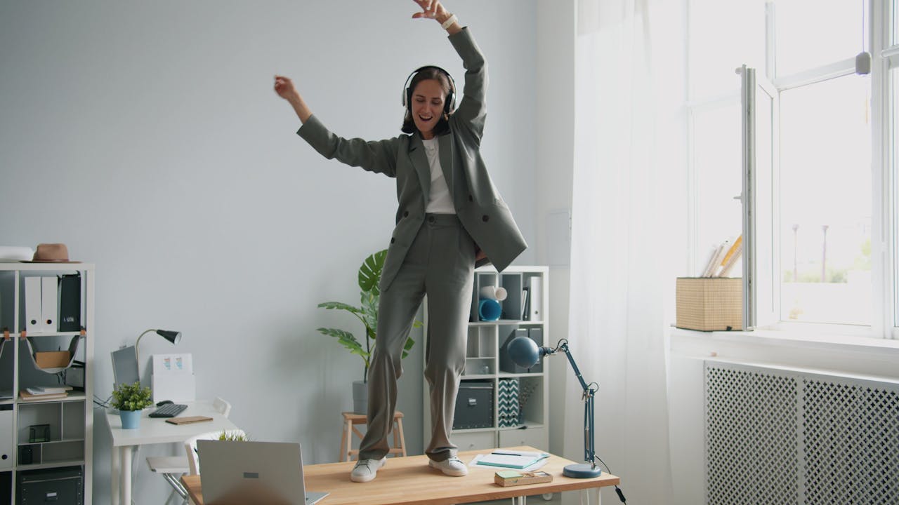celebrating woman on desk