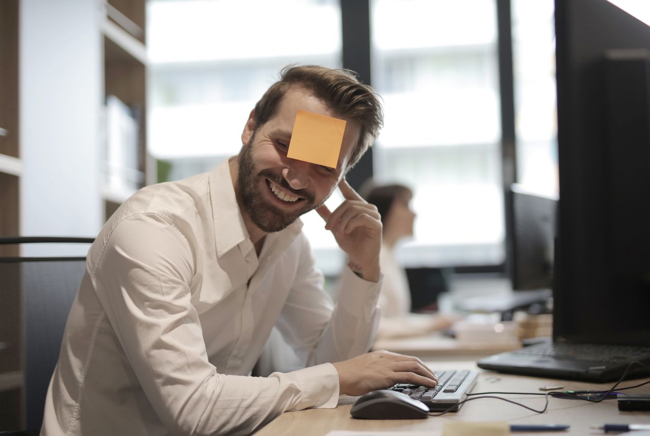 man with note on head